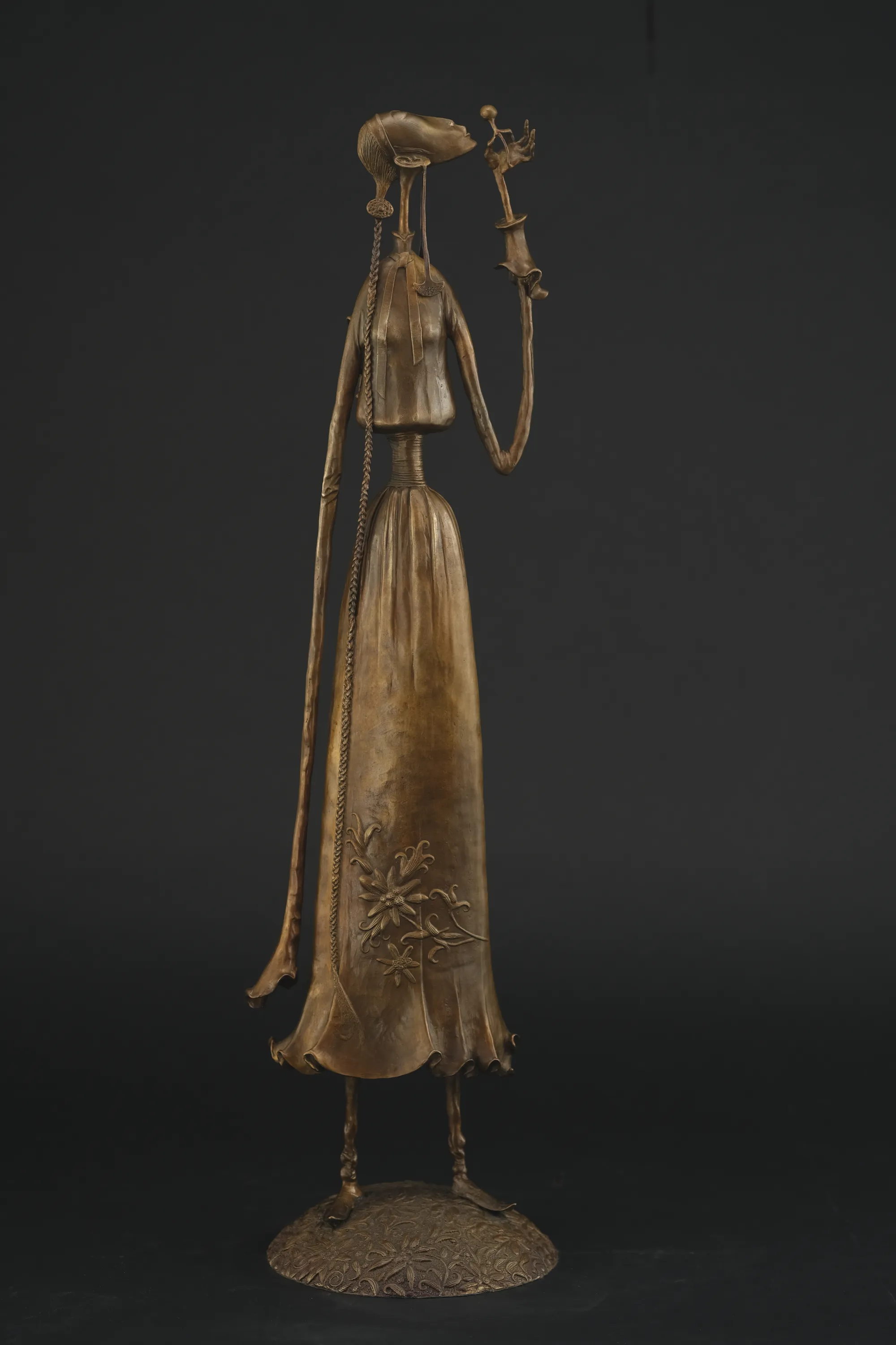 A Girl Blowing a Dandelion